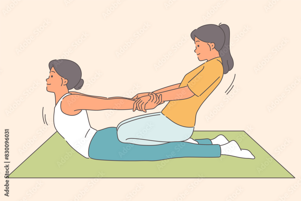 Thai massage for woman lying on floor, from girl masseur pulling patient hands to straighten spine