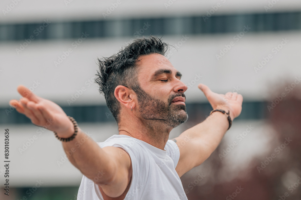 Fototapeta premium casual style young man on the street relaxed meditating
