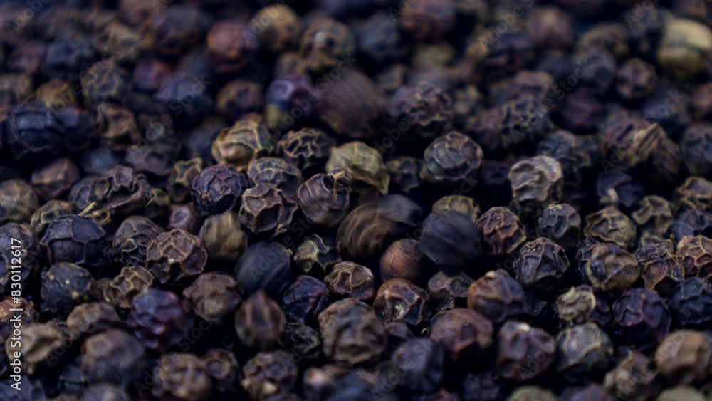 Black pepper peppercorns falling down close up Black pepper peppercorns falling down close up