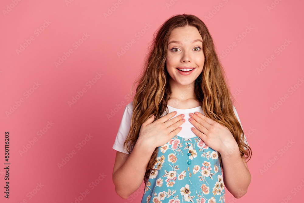 Portrait of lovely young girl empty space ad wear dress isolated on pink color background Portrait of lovely young girl empty space ad wear dress isolated on pink color background