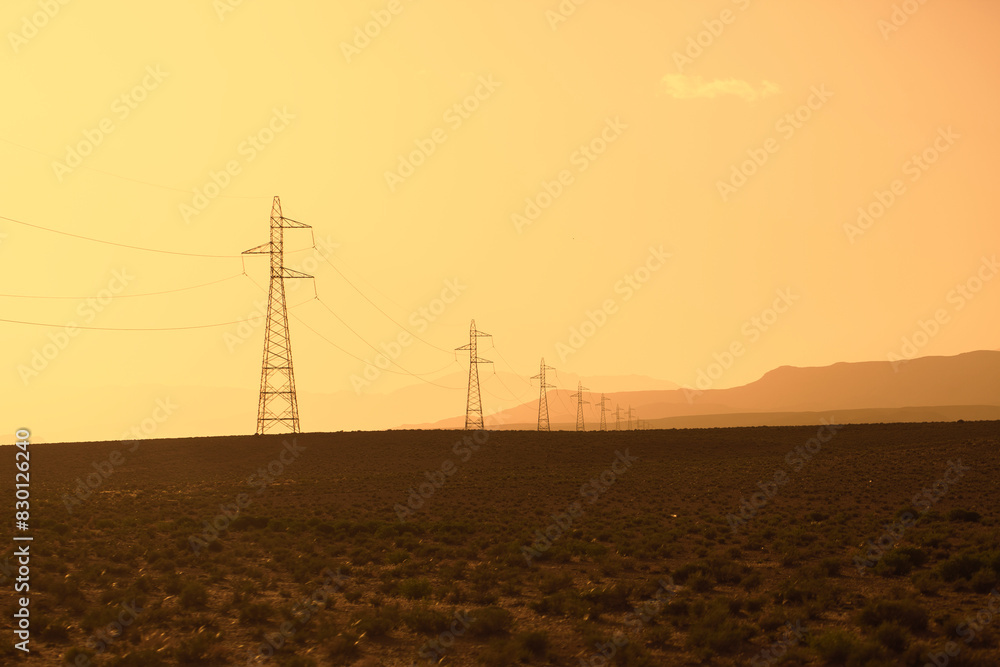 Electric power poles in southern Morocco desert