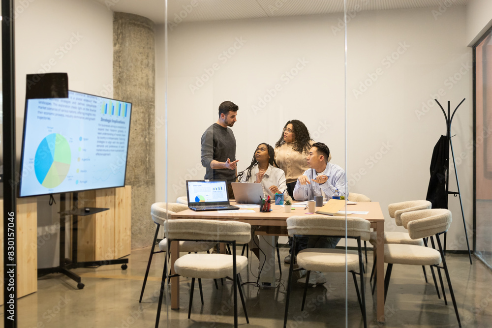 Diverse Team Collaborating in Modern Coworking Space Diverse Team Collaborating in Modern Coworking Space