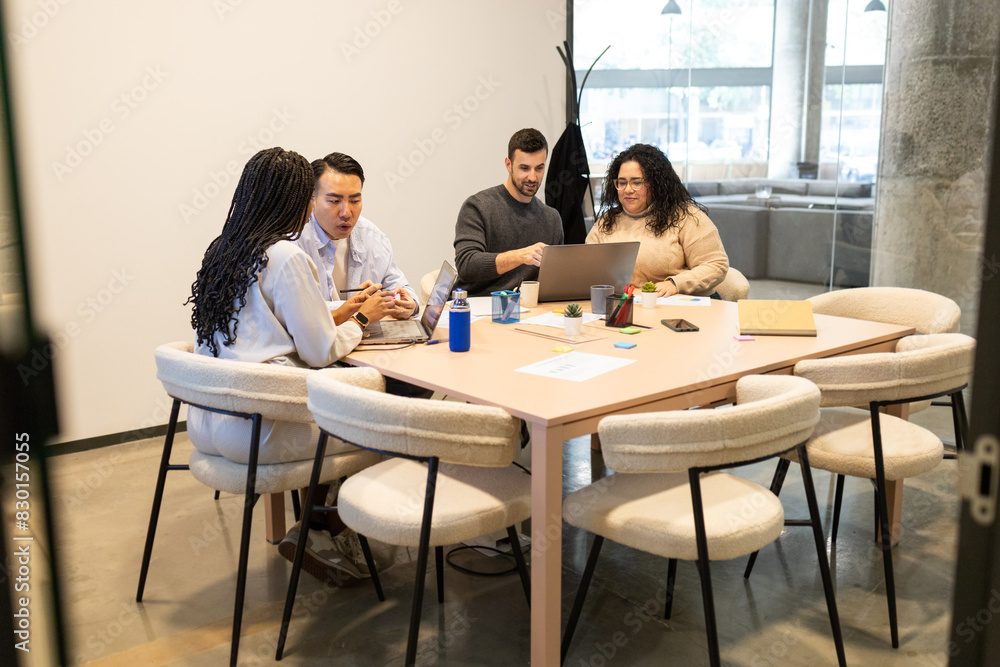 Creative Team Collaborating in Modern Coworking Space Creative Team Collaborating in Modern Coworking Space