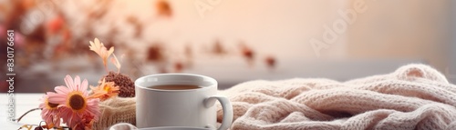 A beautiful still life of a coffee cup on a knit blanket with flowers in the background  soft natural light  cozy and warm ambiance  high detail 8K   high-resolution  ultra HD up32K HD