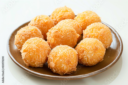 a plate of cheese balls on a white table