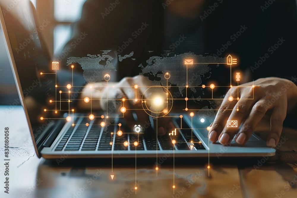 Naklejka premium Person using laptop with world map and icons