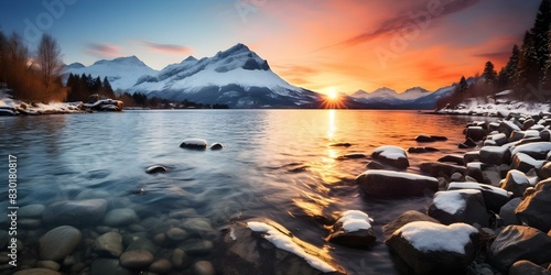 Winter Sunset at Lake Annecy, Haute-Savoie, France: A Scenic View of Snowy Mountains in the French Alps. Concept Sunset, Lake Annecy, Snowy Mountains, French Alps, Scenic Views