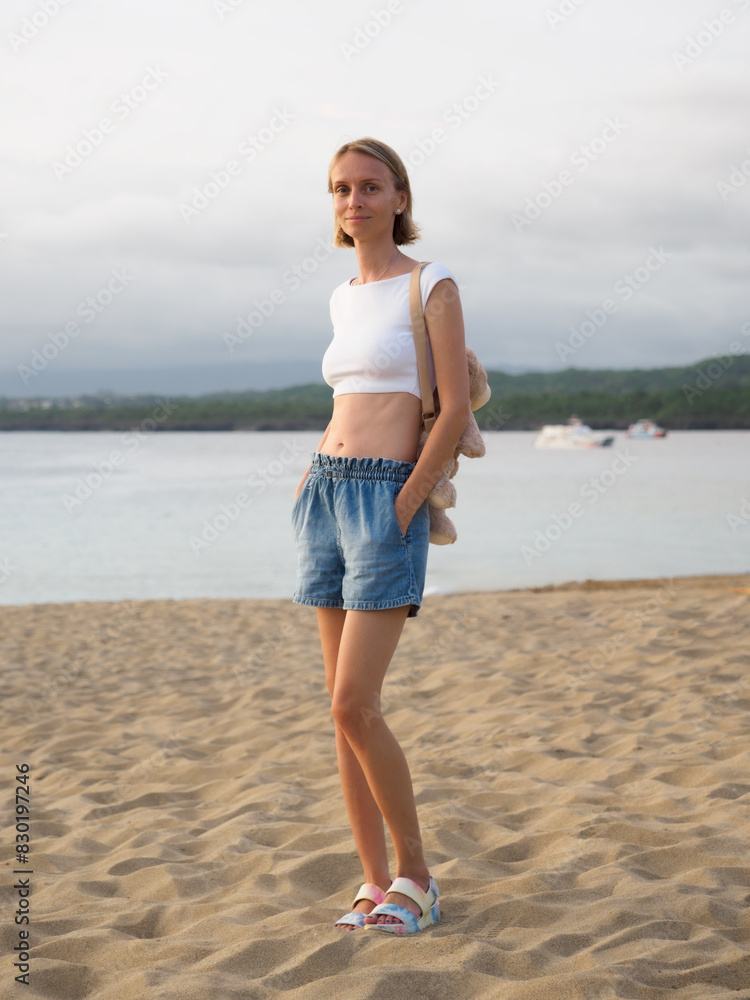 Attractive slim stylish woman, enjoying tropical sandy beach vacation. Attractive slim stylish woman, enjoying tropical sandy beach vacation.