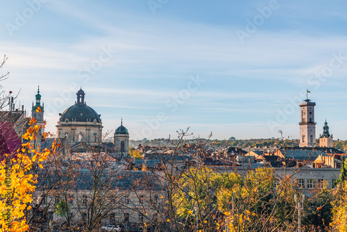Panoramic view of the roofs of Lviv with the tower of the Lviv Town Hall and the dome of the Dominican Church on an autumn morning, Ukraine. Beautiful cityscape. View from above