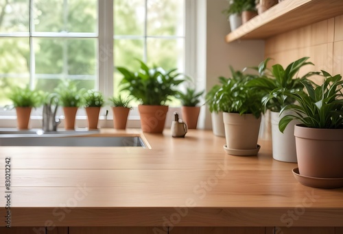 A wooden kitchen counter with potted plants and greenery in the background  with a blurred outdoor scene visible through a window