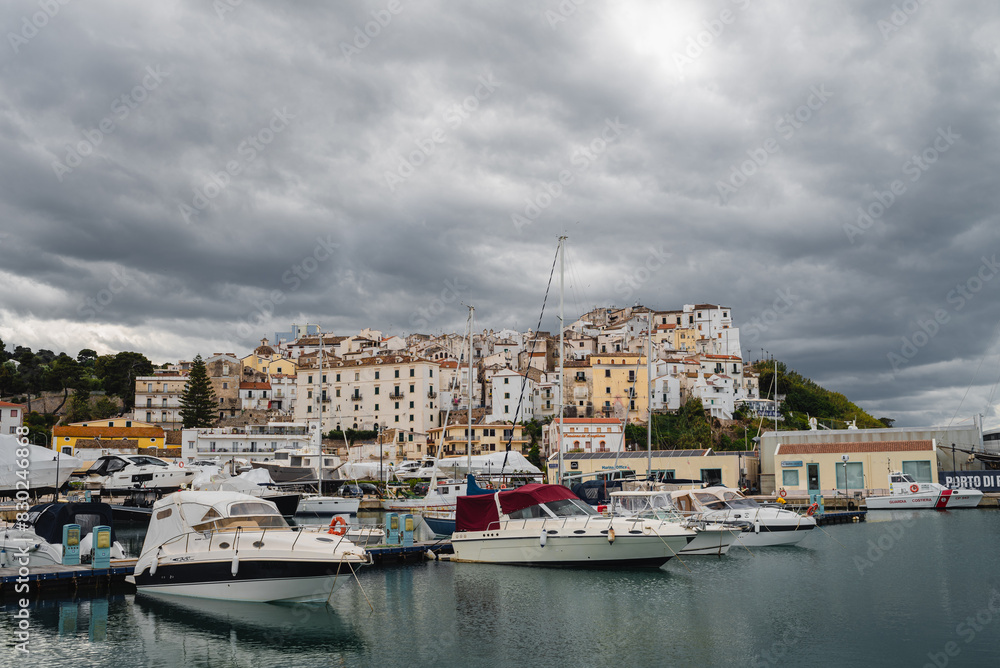View of yachts and town in Rodi Garganico harbor. Italy View of yachts and town in Rodi Garganico harbor. Italy