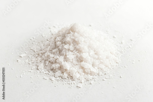 Heap of white salt crystals on white background