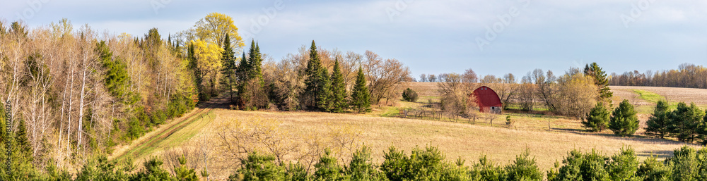 Wisconsin farmland with red barn in April Wisconsin farmland with red barn in April
