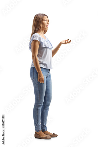 Young woman standing and gesturing with hand