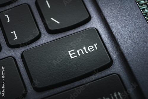 Close-Up of Enter Key on a Black Keyboard in Low Light