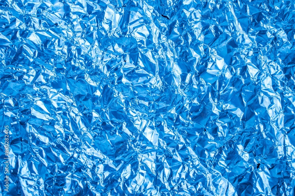 crumpled sheet metal painted blue. background or texture crumpled sheet metal painted blue. background or texture