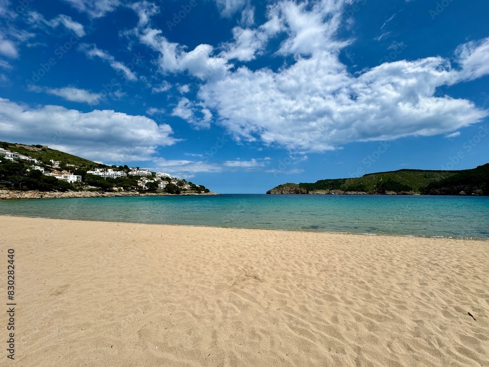 Cala Montgó with white sandy beach Platja de Montgó and beautiful turquoise water of the Mediterranen Sea near L'Escala, Girona, Catalonia, Costa Brava, Spain