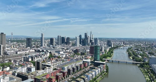 The skyline of Frankfurt am Main, Germany on a sunny day. Financial districtict, main river, high rise buildings. Urban aerial overview. photo
