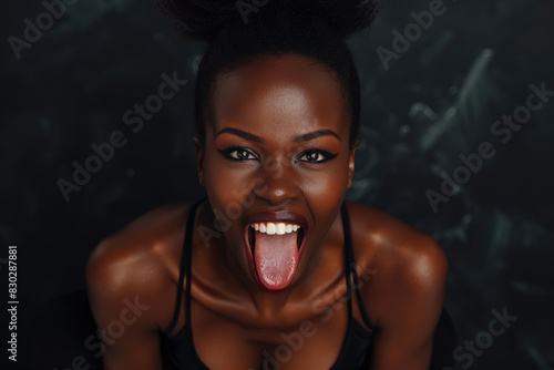 A woman playfully sticks out her tongue in a humorous gesture