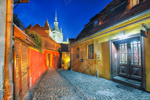 Amazing night view of historic town Sighisoara and Clock Tower built by Saxons. photo