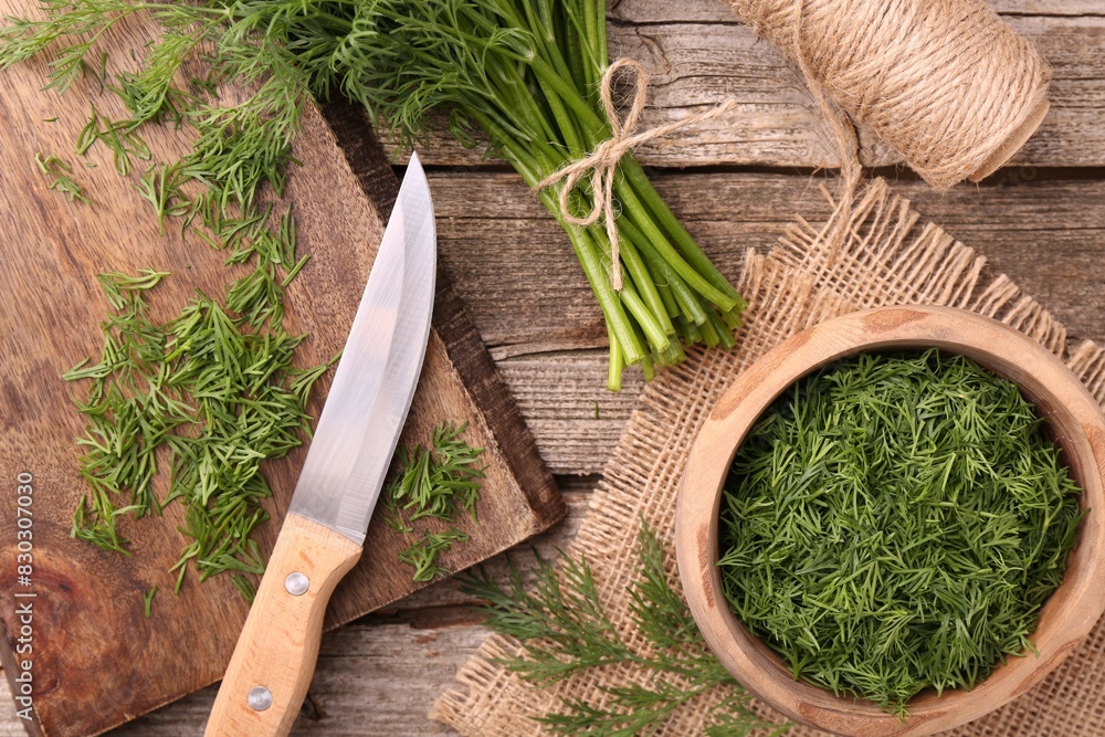Flat lay composition with fresh dill on wooden table Flat lay composition with fresh dill on wooden table