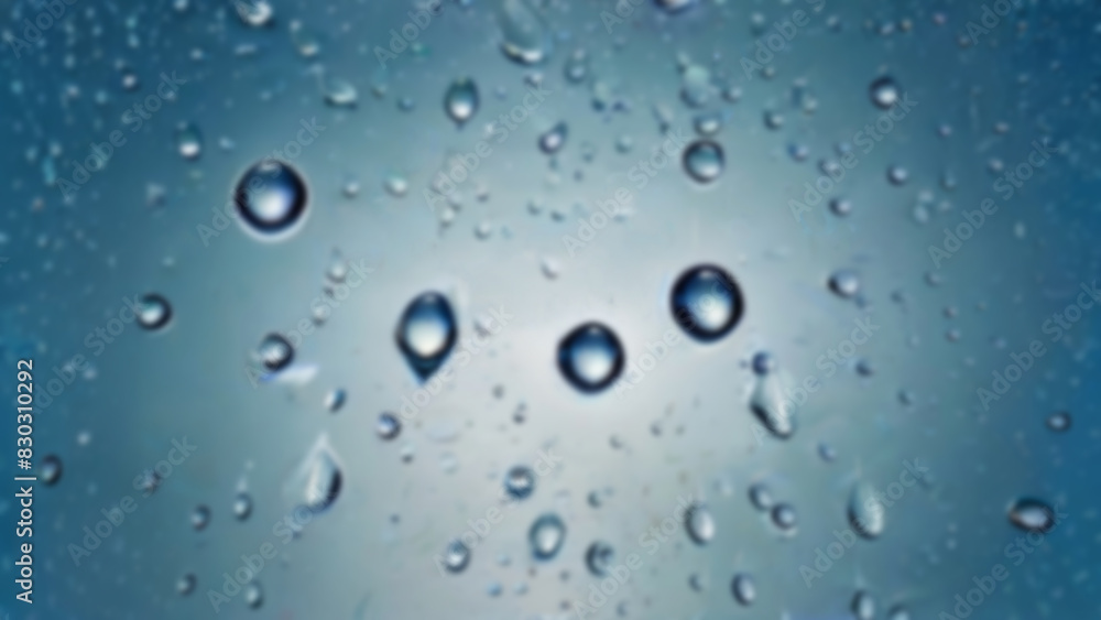 blurred blue background of drops on glass. background with drops blurred blue background of drops on glass. background with drops