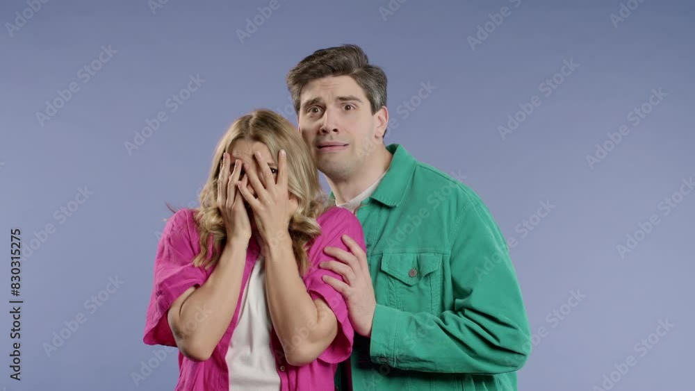 Frightened white american couple afraid of something. Man and woman in shock. Frightened white american couple afraid of something. Man and woman in shock.