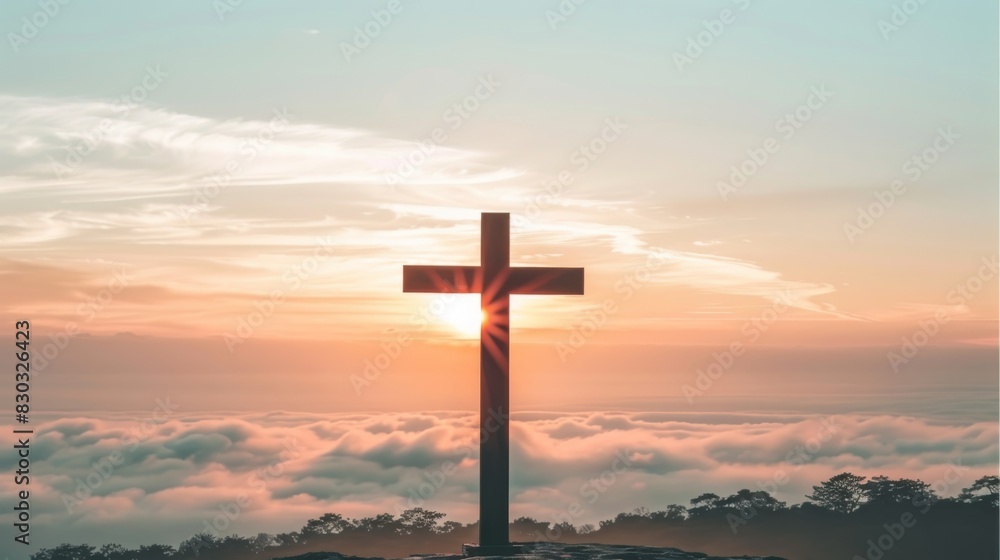 Sunset silhouette of a cross on a hilltop above the clouds Sunset silhouette of a cross on a hilltop above the clouds
