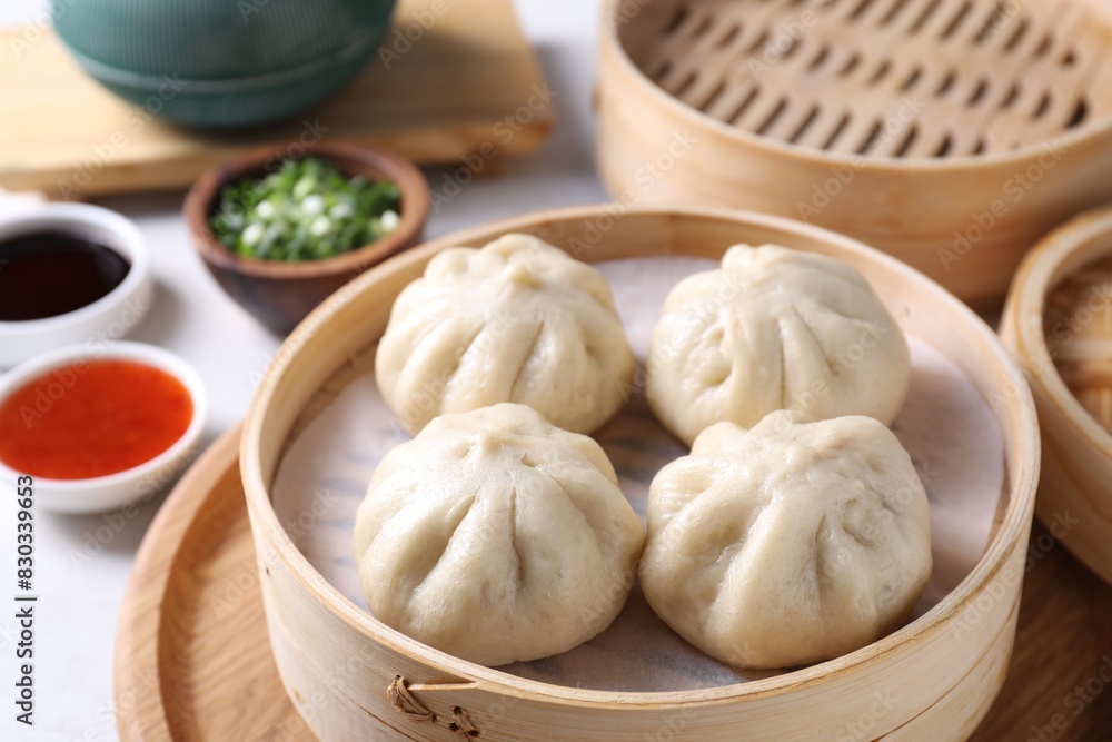 Delicious bao buns (baozi) on light table, closeup Delicious bao buns (baozi) on light table, closeup