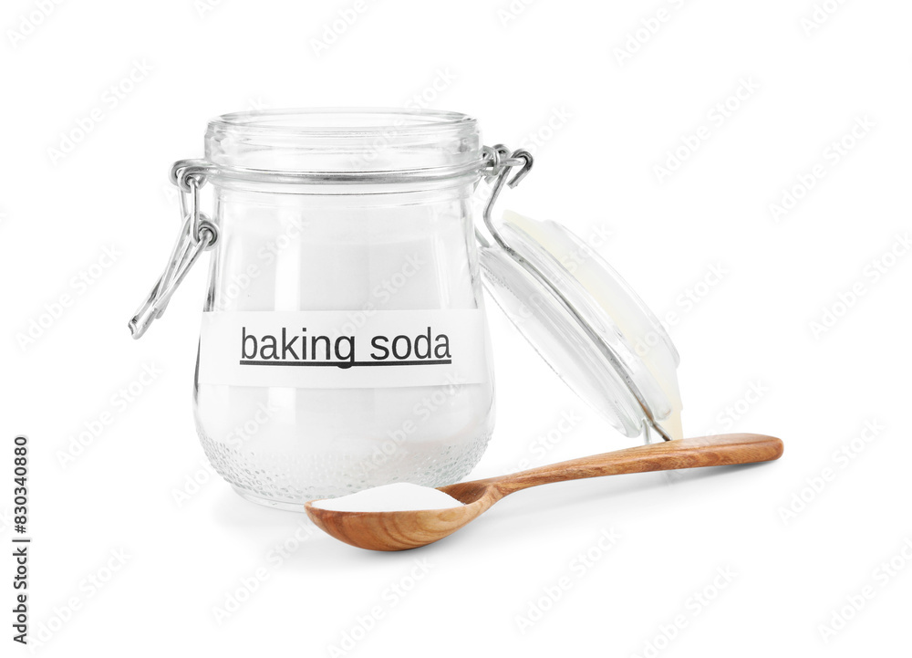 Baking soda in jar and spoon isolated on white Baking soda in jar and spoon isolated on white