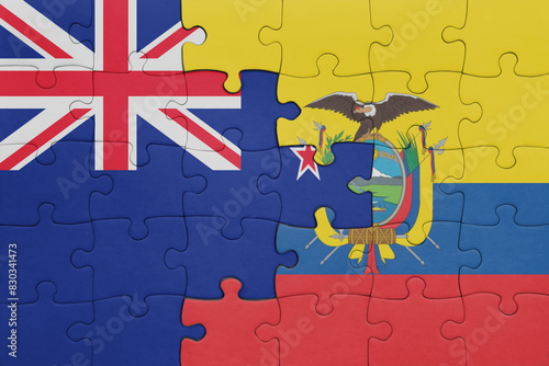puzzle with the colourful national flag of ecuador and flag of new zealand.