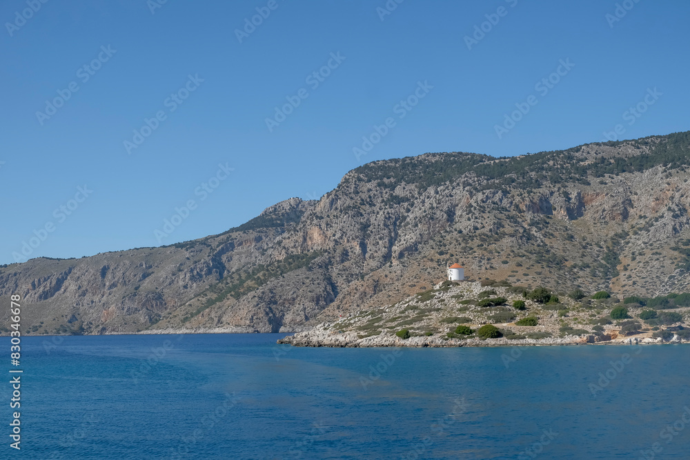 Fototapeta premium Windmühle in der Bucht von Panormitis, Insel Symi