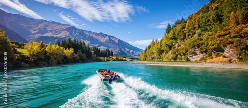 A group of people are on a boat in a river, enjoying the beautiful scenery photo