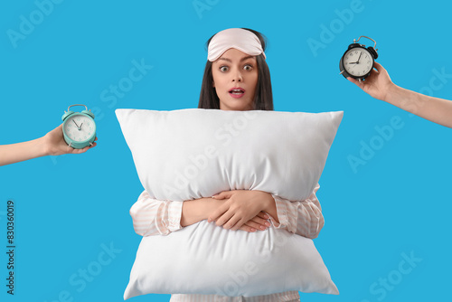 Shocked young woman holding...