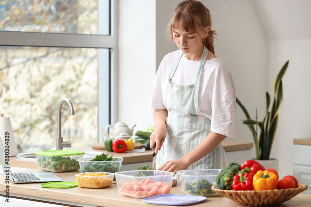 Woman preparing vegetables for freezing in kitchen Woman preparing vegetables for freezing in kitchen