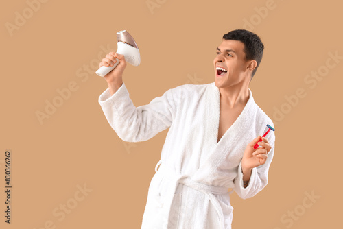 Happy young man in white ro...