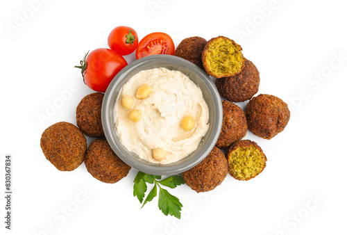 Delicious falafel balls, tomatoes and bowl with hummus on white background photo