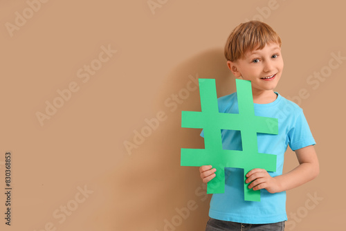 Cute little boy with hashta...