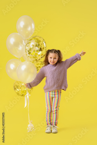 Happy little girl with ball...