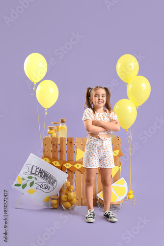 Cute little girl near lemon...