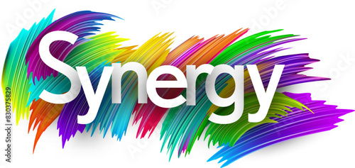 Synergy paper word sign with colorful spectrum paint brush strokes over white.