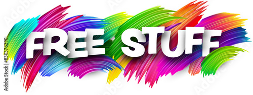 Free stuff paper word sign with colorful spectrum paint brush strokes over white.