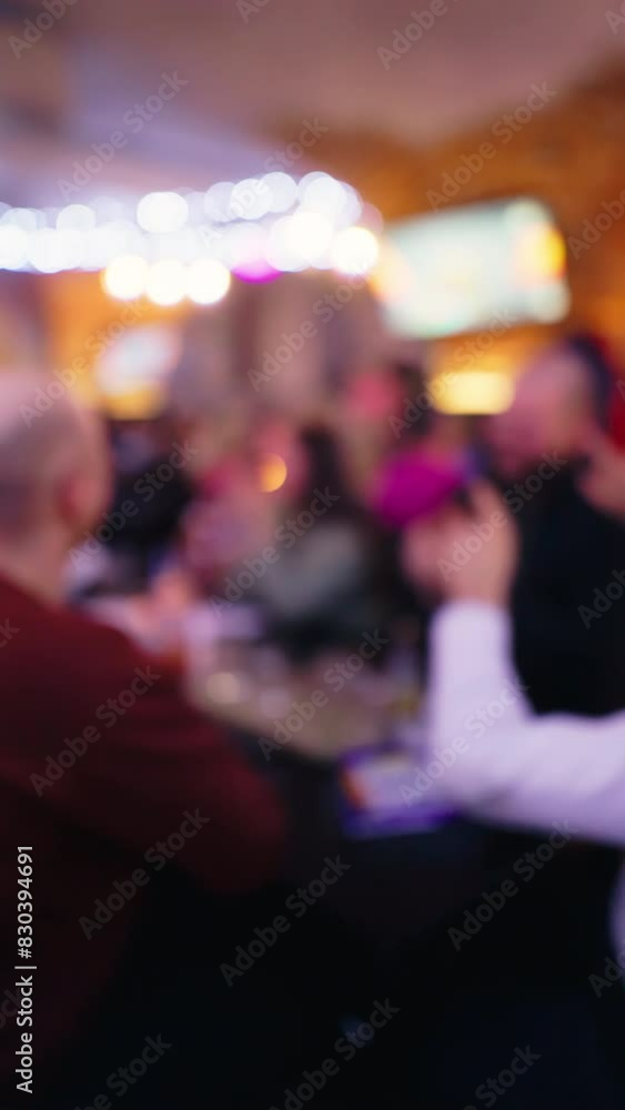 Vertical Defocused Shot of Friends at Pub Quiz Night Vertical Defocused Shot of Friends at Pub Quiz Night