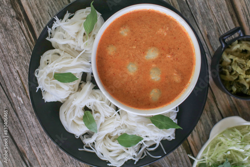 Rice noodles in a fish curry sauce with fish ball eat with vegetables. Traditional Thai food call  Kanom Jeen Nam Ya 