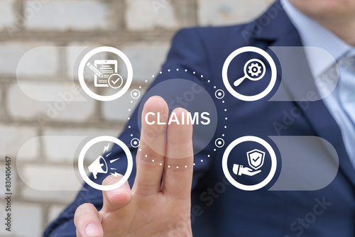 Obraz na płótnie Business man working on virtual touch screen presses word: CLAIMS. Claims Management Business Department Concept. Registration claim document. w salonie