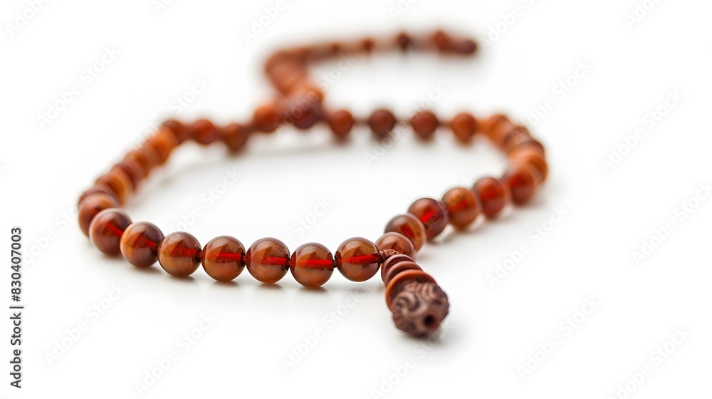 Closeup of tasbih or rosary on a white background. Selective focus and copy space. Closeup of tasbih or rosary on a white background. Selective focus and copy space.