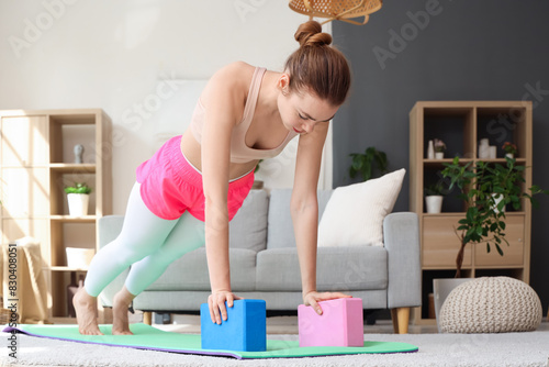 Sporty young woman training...