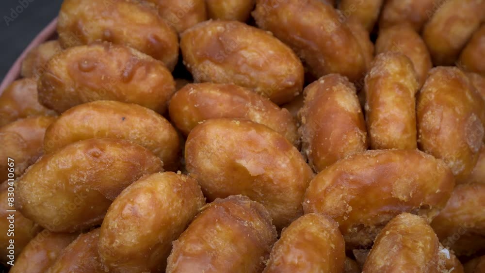 gemblong, original food from indonesia. made by sticky rice coated by palm sugar gemblong, original food from indonesia. made by sticky rice coated by palm sugar