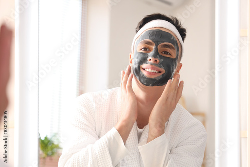 Young man with applied clay...