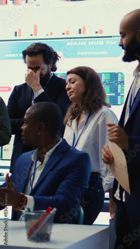 Vertical Video Displeased project manager sharing the failure with his team, employees feeling disappointed and frustrated about unsuccessful partnership. Furious CEO and dissatisfied associates